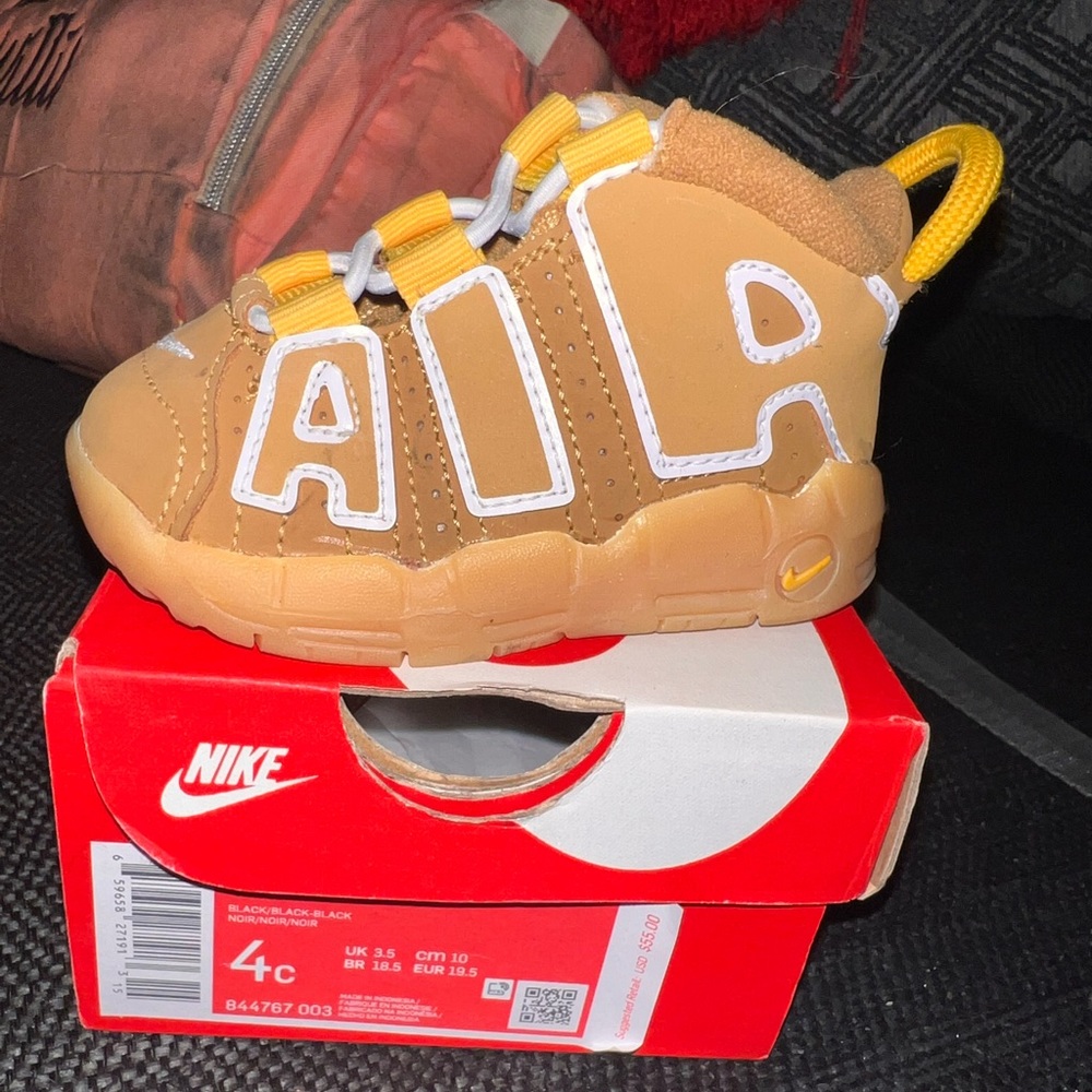 Tan and white nikes